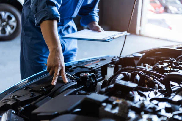 Mechanic inspecting car at Tiny’s Mechanical Services Capalaba